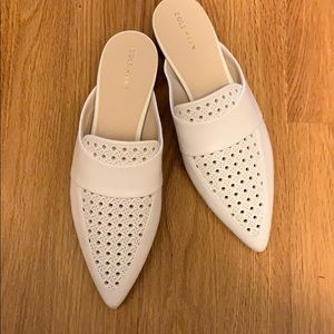 Cole Haan white slides.